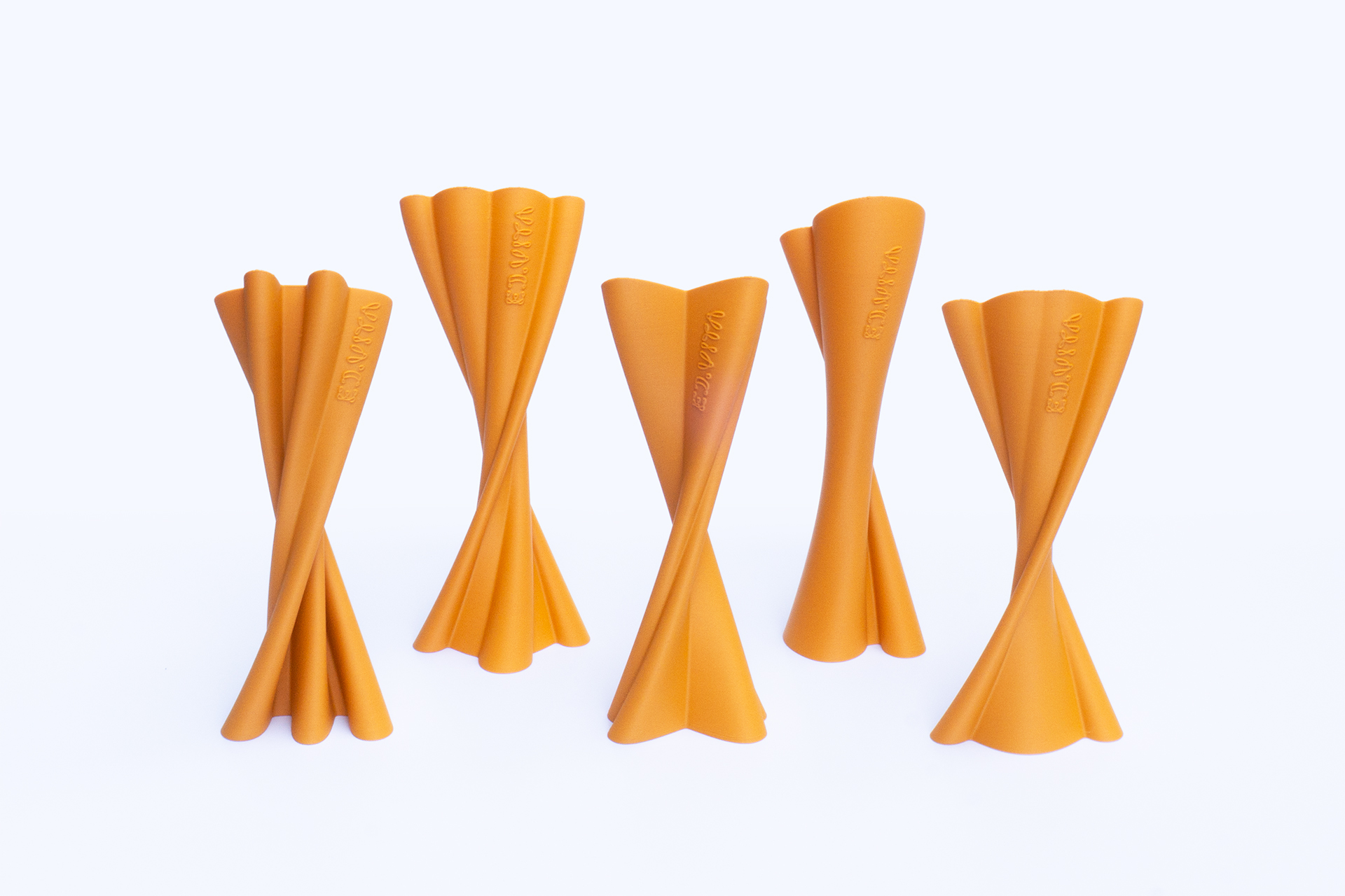 3D printed ED.VITA trophy in sustainable PLA-wood composite, suitable for industrial composting, featuring extruded logo form with rotation, elegant, lightweight, and prestigious design for the Sustainability in Education Award, including one large trophy and five smaller awards representing individual thematic categories.